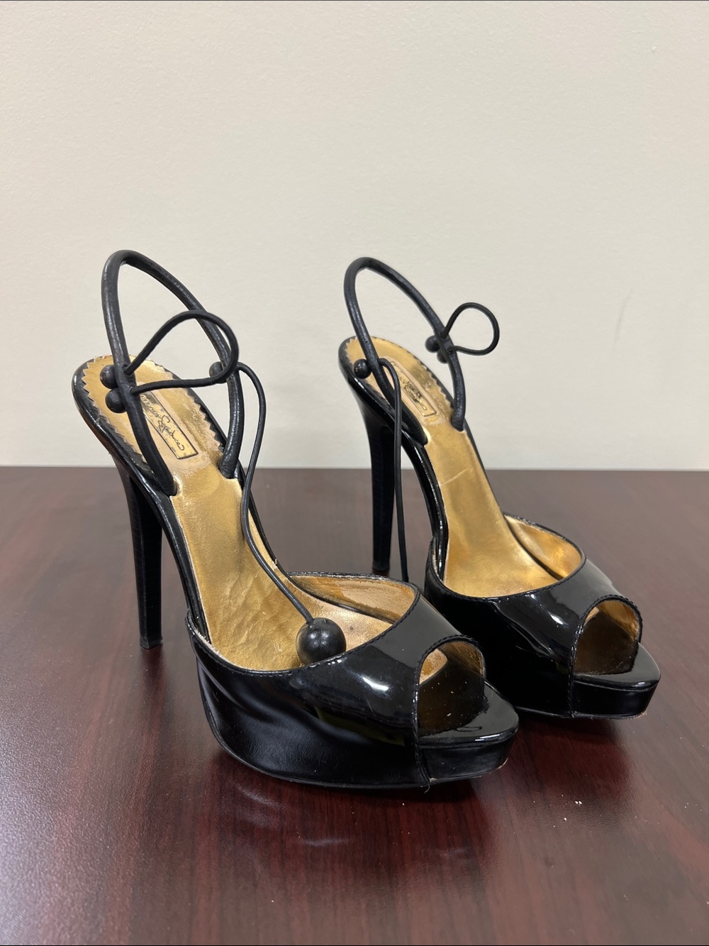 Report Signature Black Patent Peep-Toe Platform Heels with Gold Insole Accents